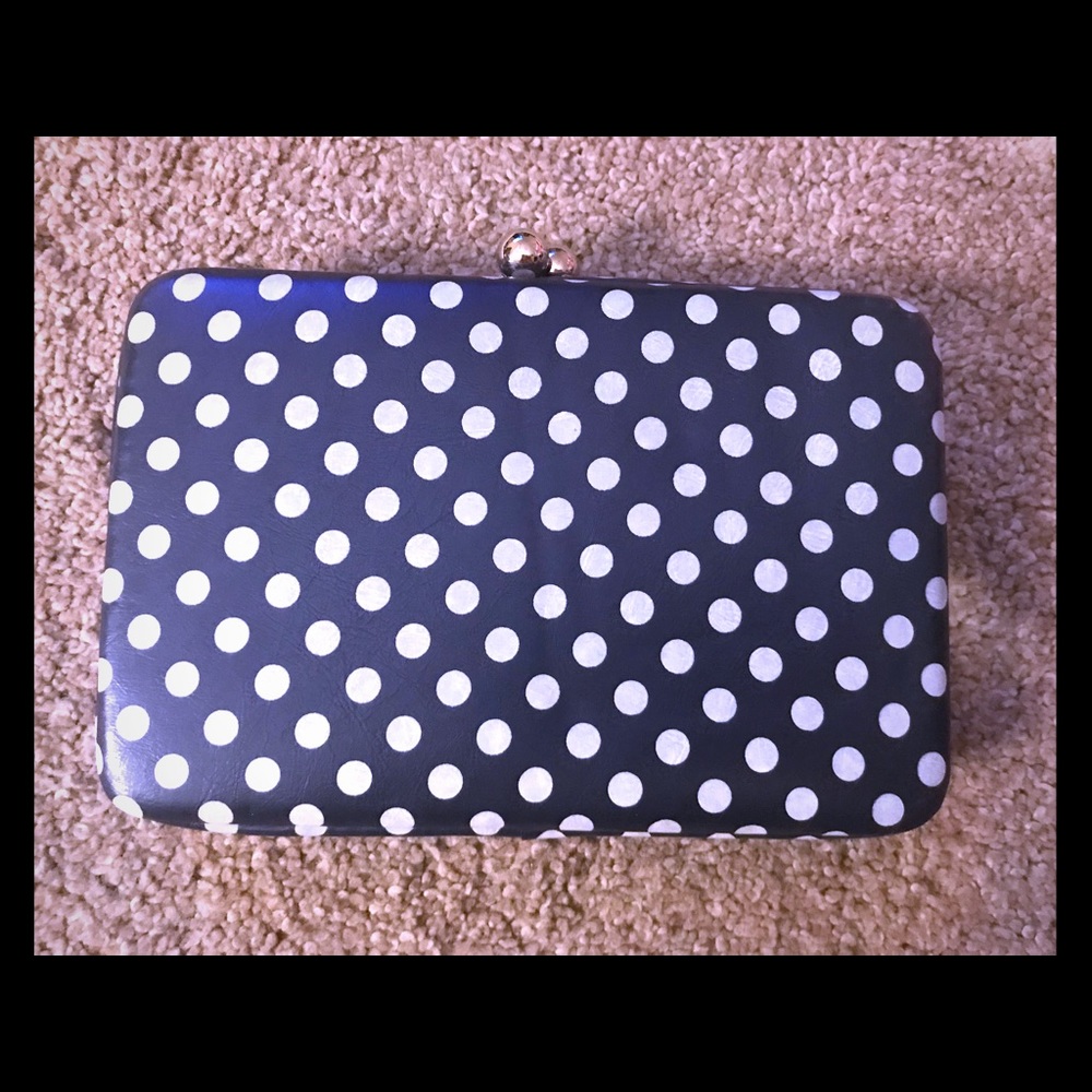 Navy and white polka dot clutch